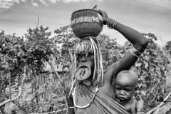 Mursi Mother and Son in a Village near Kuraz Omo Valley Ethiopia